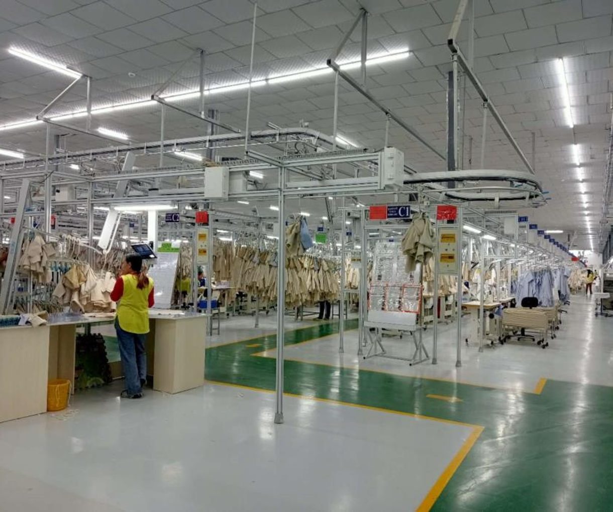 Sewing floor with overhead hanger system